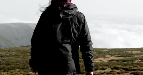 Serra da Estrela Mountains, Portugal - Woman raising her hands in freedom on the mountaintop - Slow