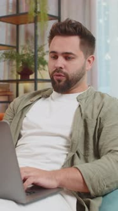 Man on Laptop Video Call from Home