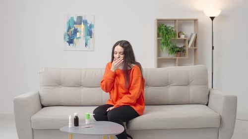 Young Woman with Cold Coughs and Uses Medicine