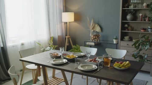 Dining Room Table Set with Food and Dishes
