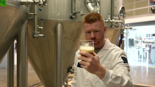 Brewmaster Inspecting Beer Quality in a Modern Brewery