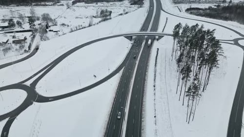 Aerial View of Highway Intersection in Snowy Winter