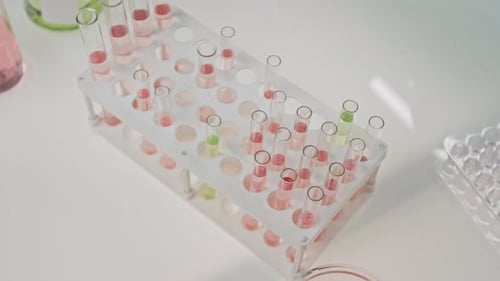 Close-up of Hand of Unrecognizable Scientist Working with Test Tubes in Lab