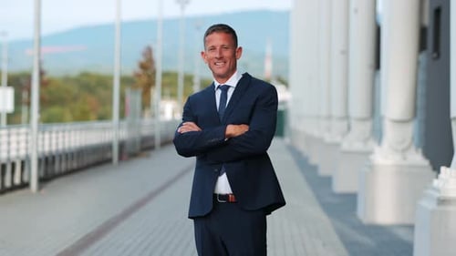 Confident Businessman in Dark Suit Smiling