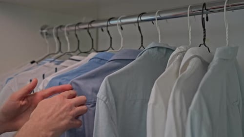 Shirts Hanging in Closet, Choosing Outfit