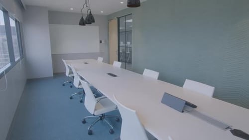 Dolly In Shot Of A Stylish And Modern Meeting Room In A Corporate Office With A High Building View