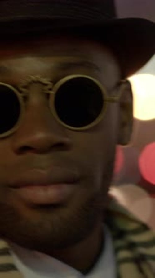 Fashionable Young Man with Round Sunglasses