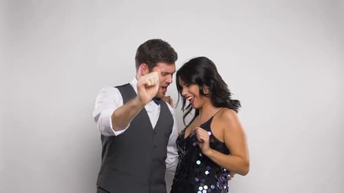 Happy Couple Dancing Together at Party