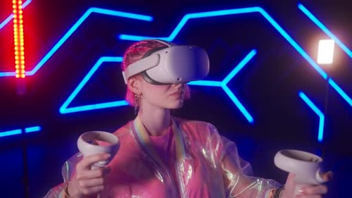 A Young Woman Wearing a VR Helmet and Playing a Game Cyber Player in a Virtual Reality Tournament
