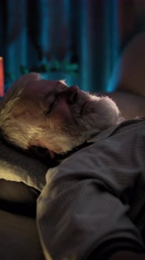 At Night Elderly Man is in Bed in a Deep Sleep His Breathing is Even and Deep