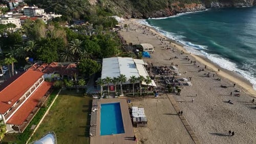 View of the Restaurant on the Seashore Terrace Full of People Relaxing on the Beach