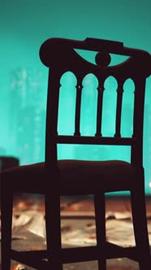 Ornate Chair Silhouette Against Abstract Shimmering Light Background