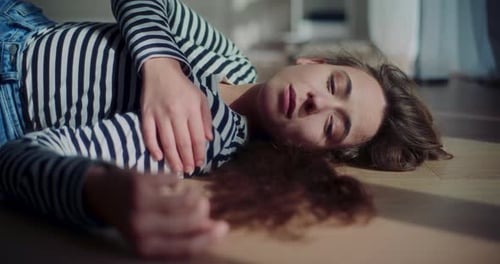 Woman Lying on Floor in Natural Light