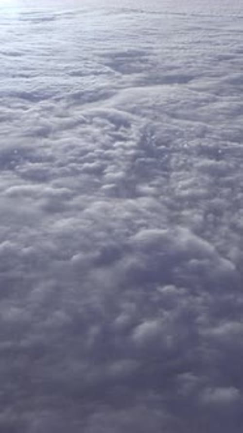 Expansive View of Soft Fluffy Clouds Covering the Sky Creating a Serene Atmosphere and Inviting a