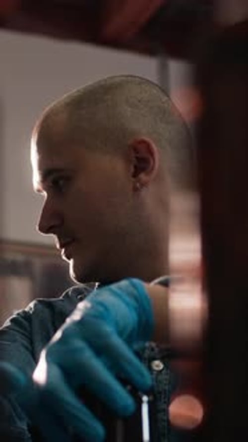 Vertical of Man Working at Cider Production Factory