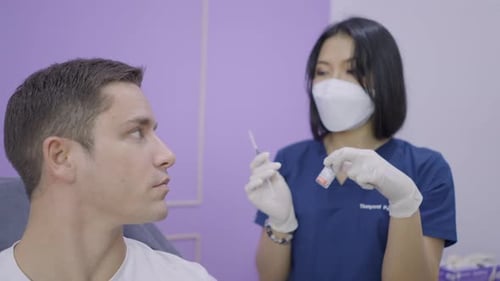 Man Receives Treatment at Clinic from Woman Doctor