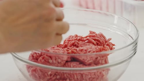 Preparing Ground Meat in Glass Bowl for Recipe