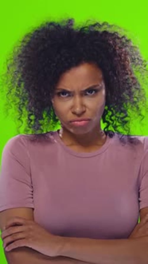 Woman Showing Different Emotions Against Green Background