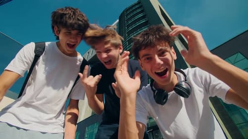 Happy Teenage Boys with Goofy Gestures Showing Hype Energy Outdoors