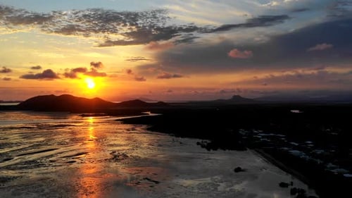 Sunrise timelapse over tropical river mouth - Townsville, North Queensland Australia