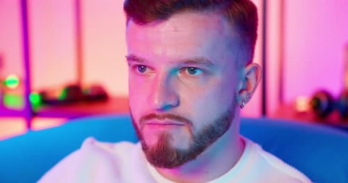 Close Up of Young Man with Beard and Piercings