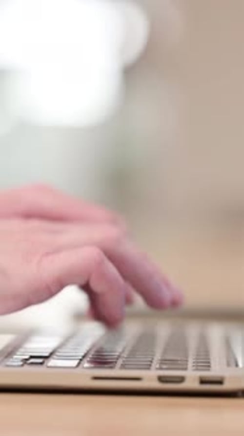 Typing on Laptop, Side View, Vertical Video