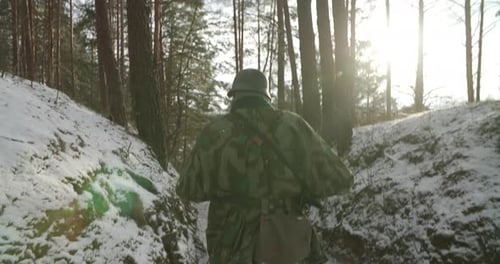 Group Of Soldiers Submachine Guns And Bazooka Marching In Forest Reenactors Dressed As German