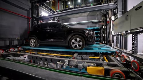 Automated car parking system rotating and lifting vehicle