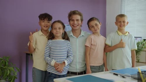 Enthusiastic Teacher with Students in Classroom