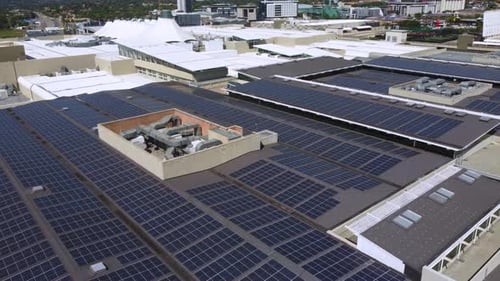 Drone shot of solar panels on commercial mall