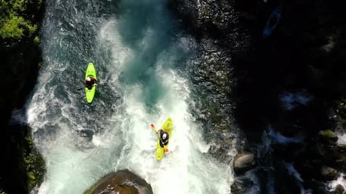 Aerial view of whitewater kayaker running class IV rapids on the Mill Creek section of the Rogue Riv