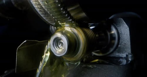 Slow motion macro of specialist is working on production of different gearing details in a worksho