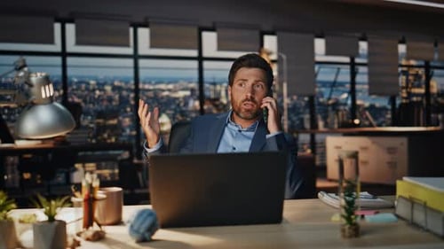 Man Working Late in a High-Rise Office