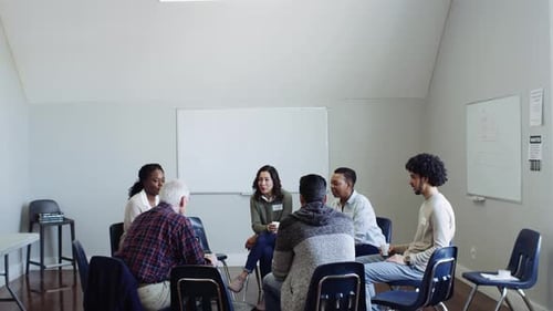 Diverse support group shares experiences and builds trust in the community center