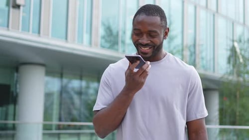 African American Man Talking on Smartphone on Street in City Outdoor Man with Cell Phone Chatting