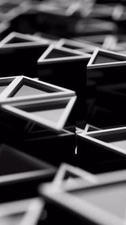 Animación abstracta en bucle de formas triangulares en movimiento con desenfoque.