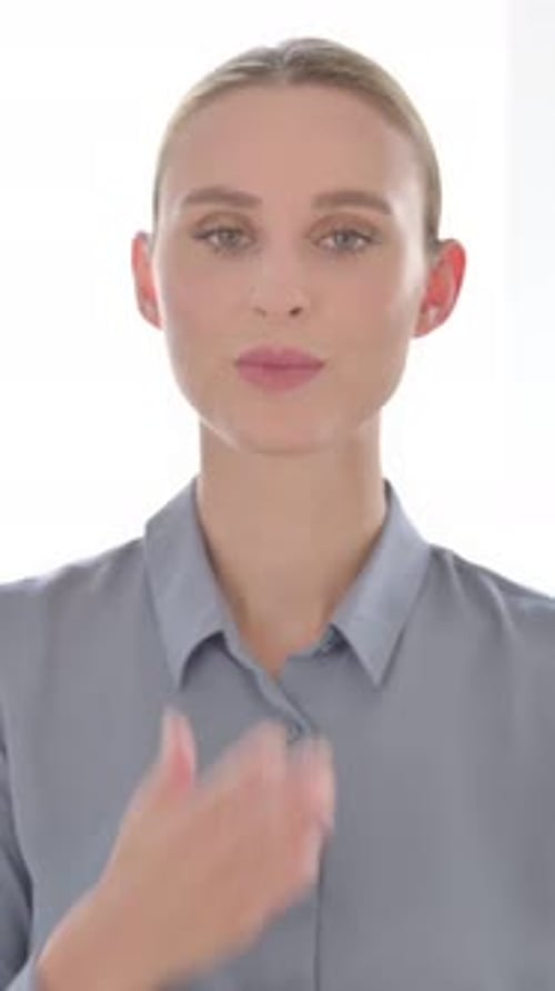 Smiling Blonde Woman Blowing Kiss in Portrait Video