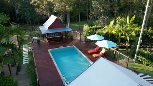 Scenic Pool Deck With Floating Candles Setup For Event, 4K Drone Flyover