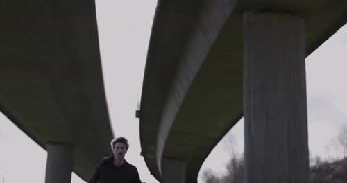 Adult man running athlete sprinting workout challenge training endurance in urban city