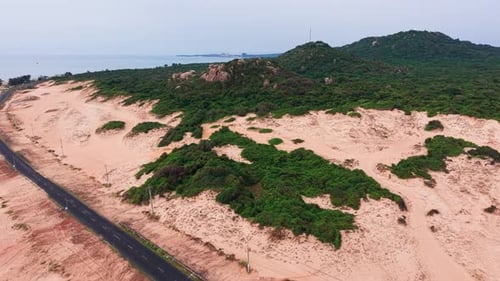 Aerial View Pan of the Beach and the Road.