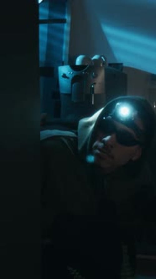 Two Thieves Appearing from around Corner and Scanning Office with Flashlights