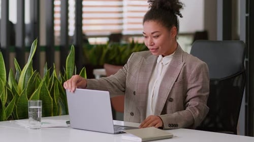 Young Woman Relaxing After Working on Laptop