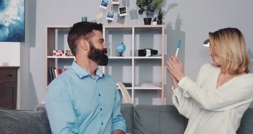 Woman Reveals Pregnancy Test Result to Bearded Man
