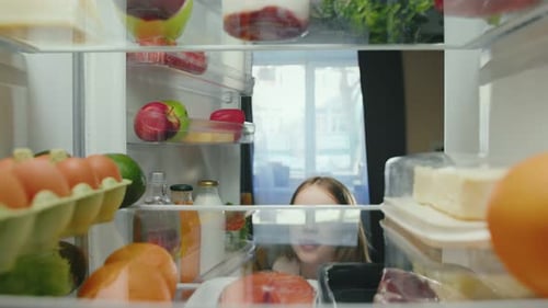 Child Reaches Into Fridge to Grab an Egg