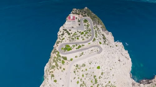 Serpentine road and lighthouse tower