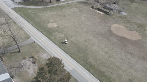 Golf cart in grass field