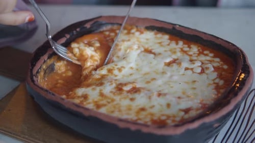 Eating Baked Pasta with Cheese