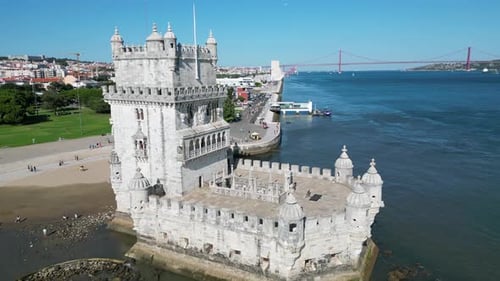 Flying Over Belem Tower (Torre de Belém) in Portugal on a Sunny Lisbon Day.