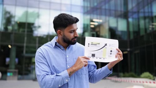 Businessman Presenting Financial Data