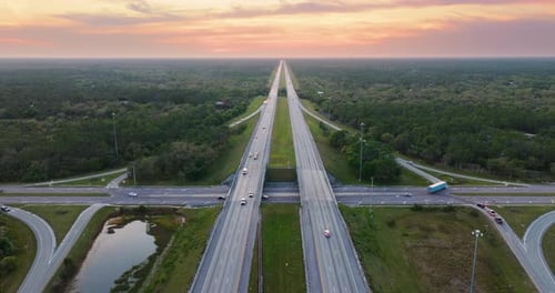 American Highway Bridge with Fast Moving Traffic in Evening Interstate Transportation Concept